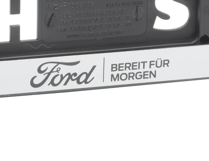 Original Ford Kennzeichenhalter silber „BEREIT FÜR MORGEN“, Ford-Emblem schwarz